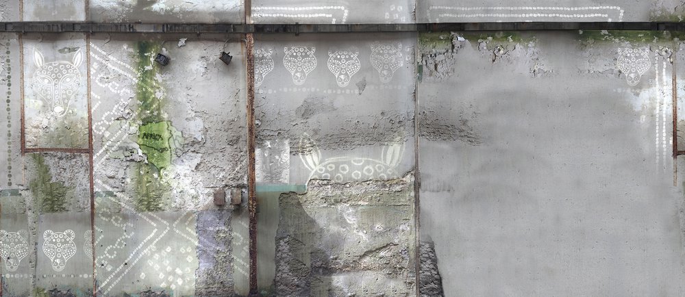 wallpaper with ethnic patterns embedded in a cement wall