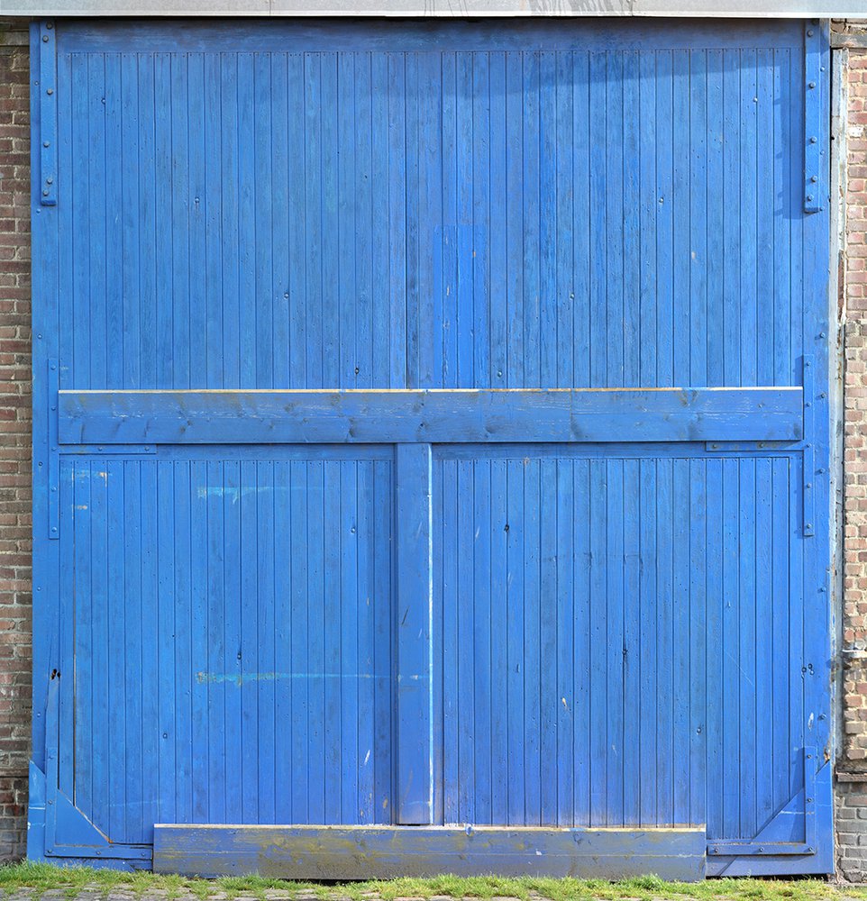 raw material wallpaper representing a blue hangar door