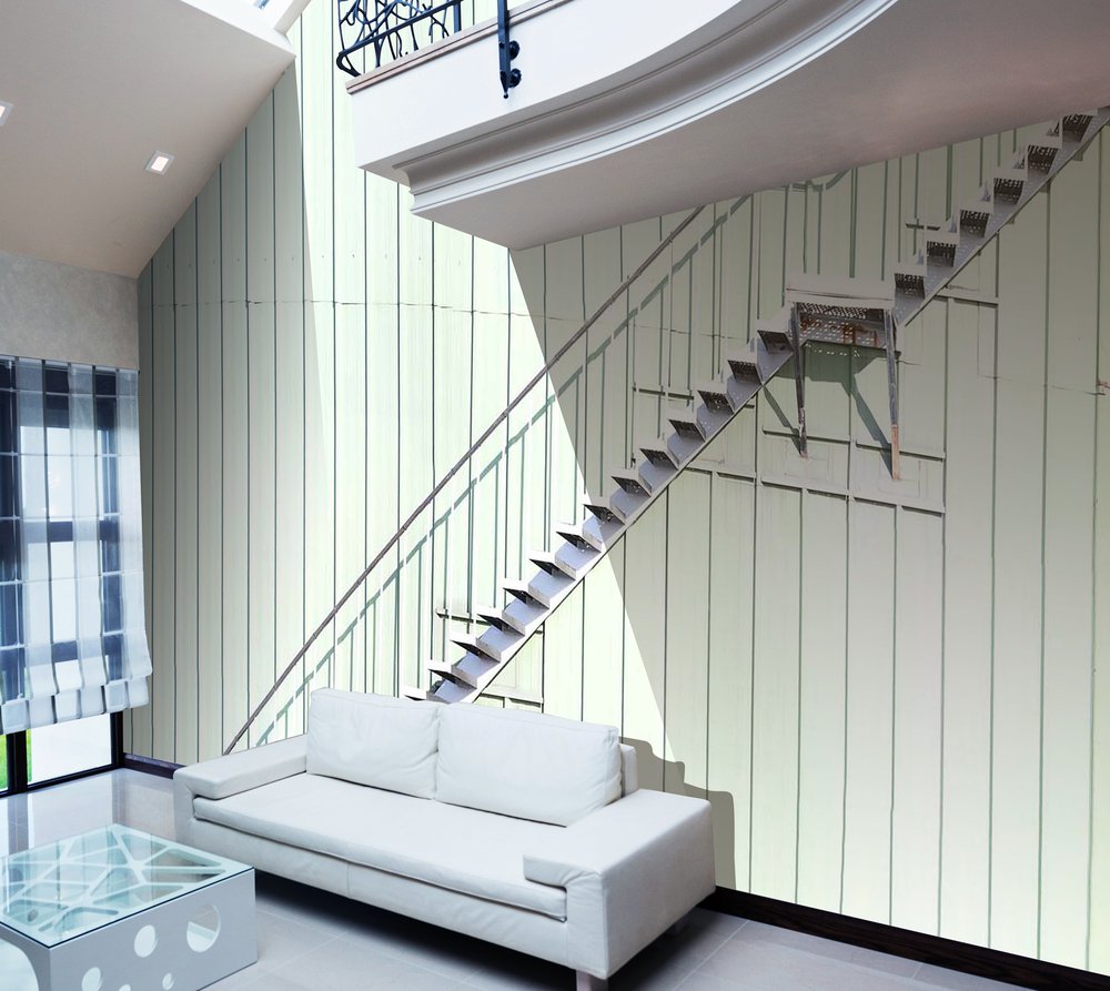 on the wall of this living room is this amazing wallpaper with a staircase