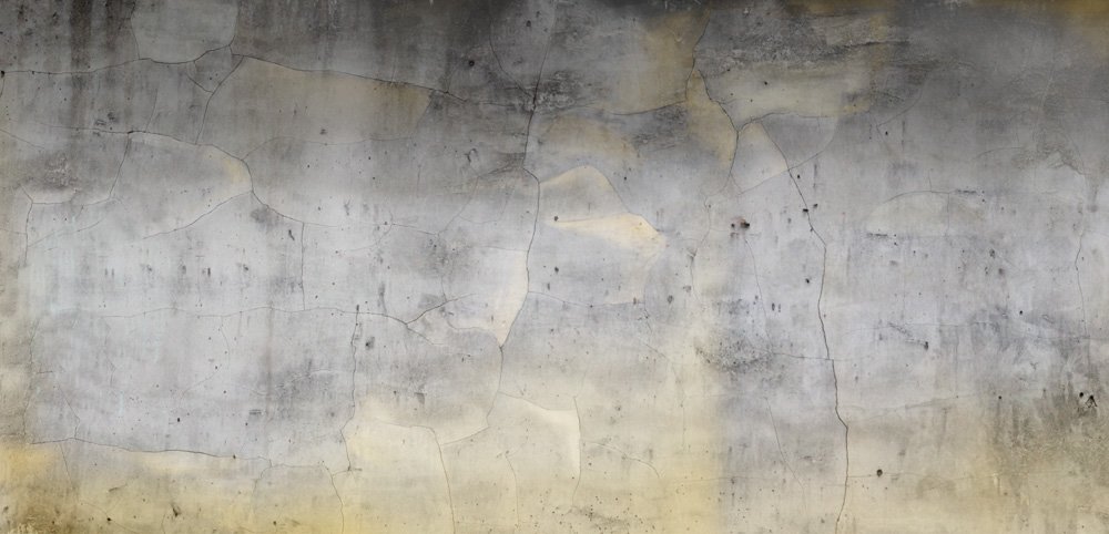 wallpaper in a living room representing a gray and gold concrete wall