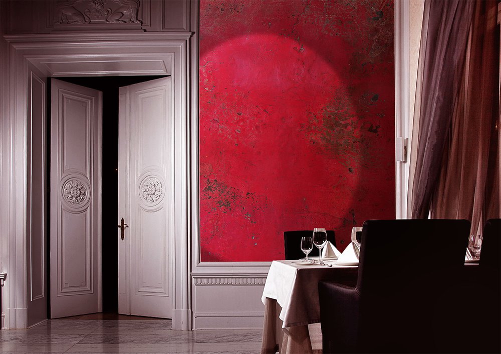 On the wall of this intimate restaurant the wallpaper brings comfort and warmth