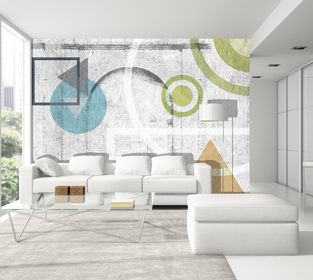 panoramic wallpaper in a living room composed of geometric patterns in color painted on a white brick wall