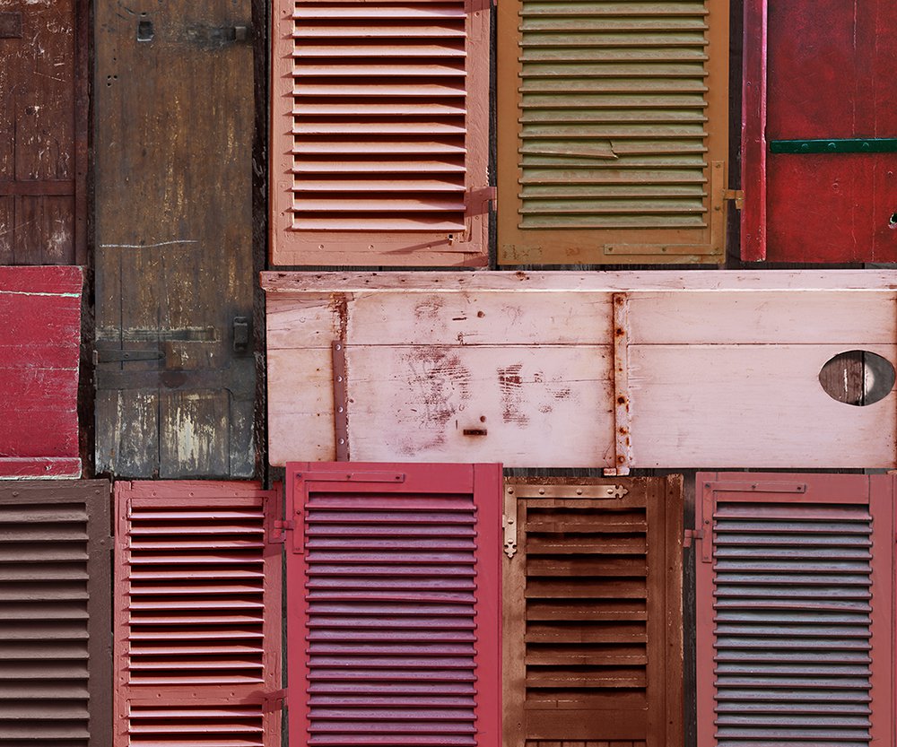 detail: warm panoramic wallpaper representing a patchwork of brown shutters